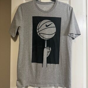 The Nike Tee Dri-Fit men’s t-shirt. Athletic cut. Basketball graphic on front.